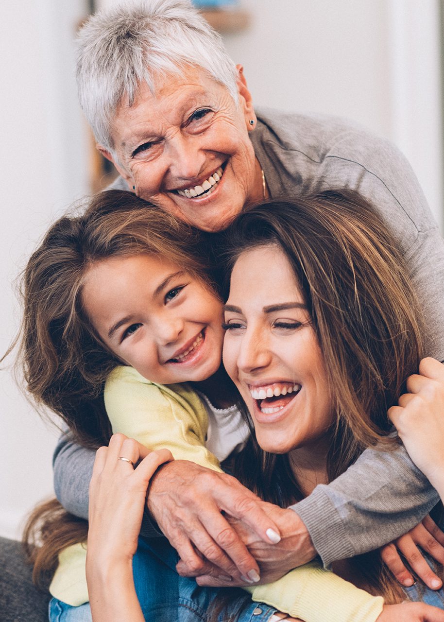 Three generations of women hugging